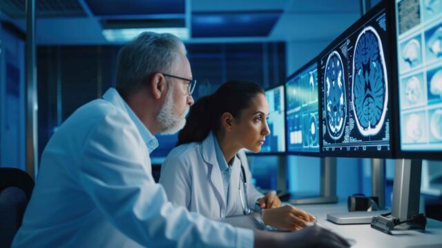 https://blog.wgs.co.id/wp-content/uploads/2024/10/medical-researchers-looking-examining-brain-scan-computer-while-working-late-office-together-640x360.jpg